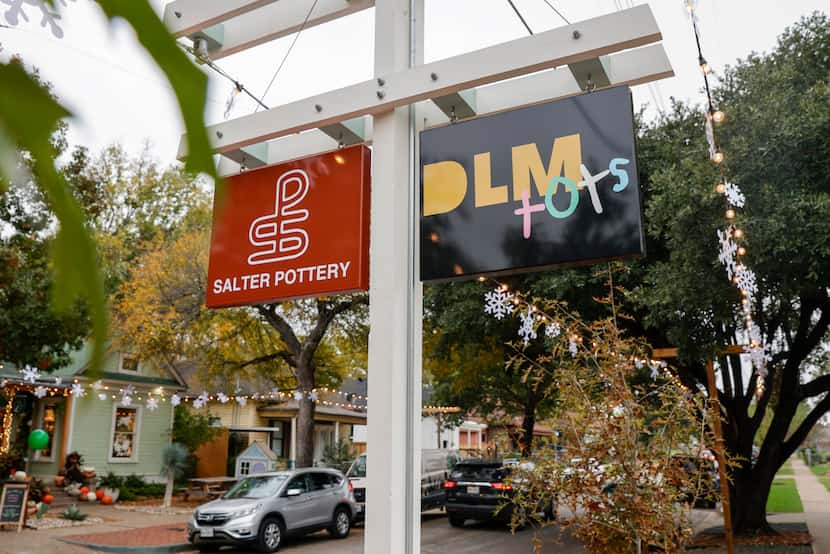 Signs for Salter Pottery and DLM Tots are pictured along 8th Street near North Bishop Avenue...