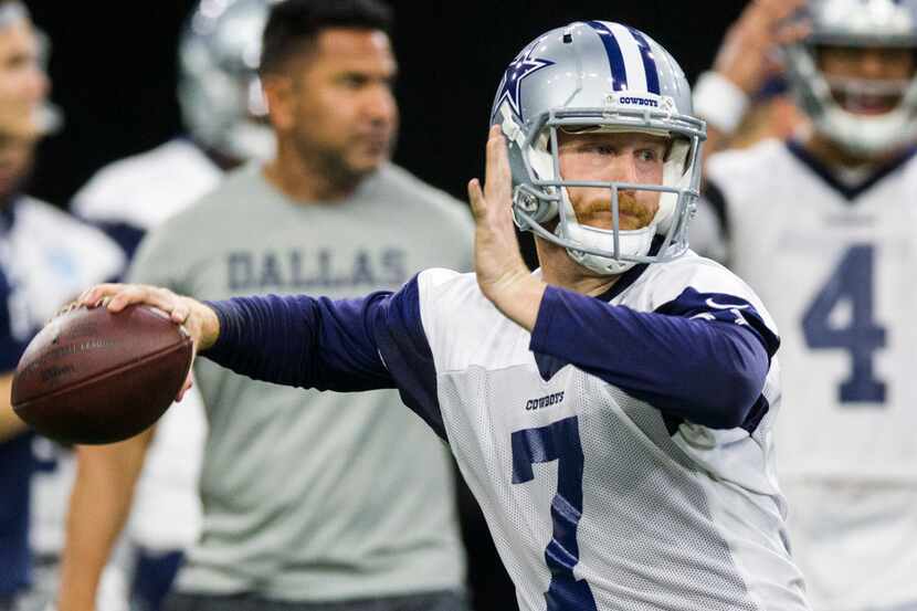 Dallas Cowboys quarterback Cooper Rush (7) throws a pass during a Dallas Cowboys OTA...