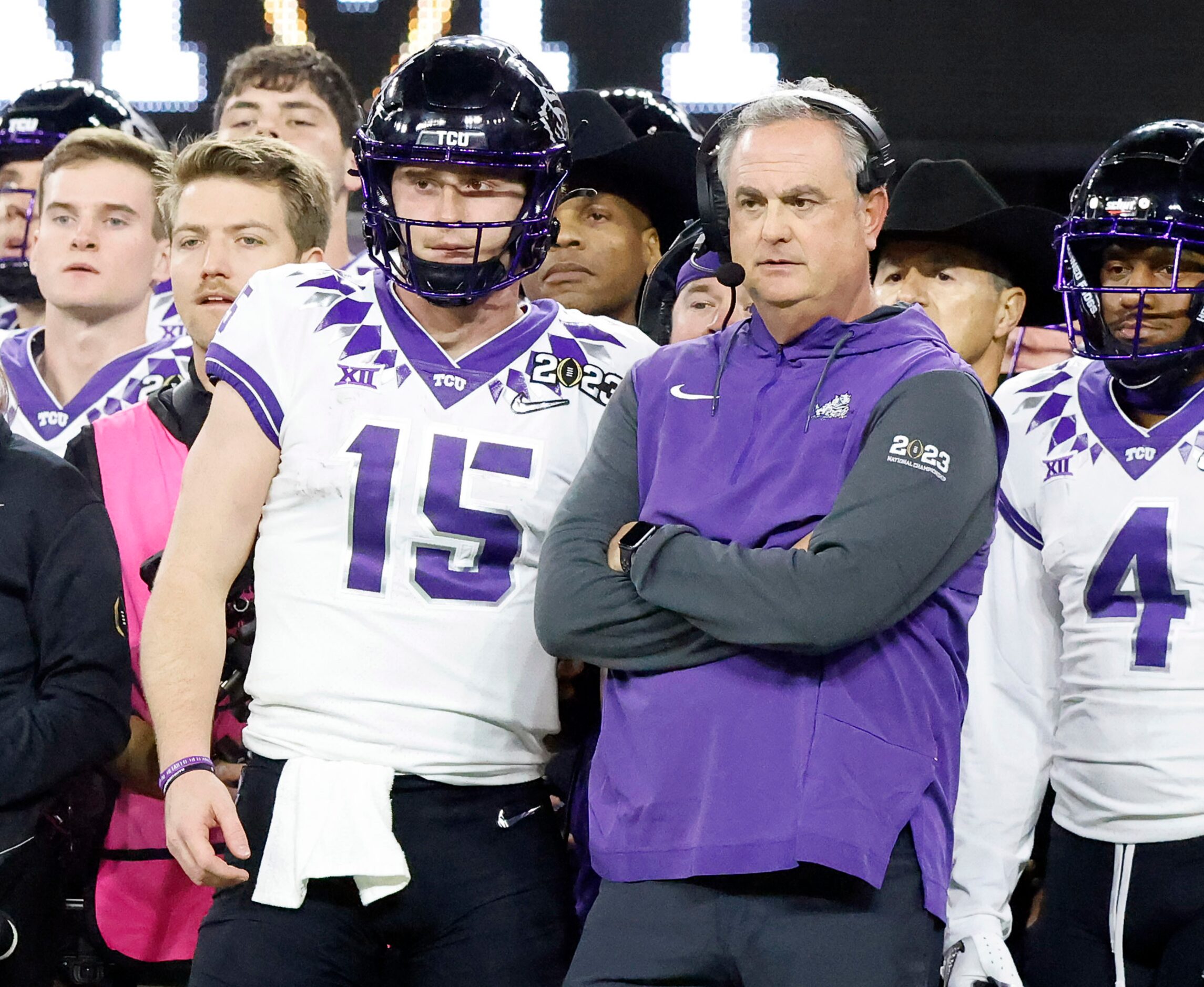 TCU Horned Frogs quarterback Max Duggan (15) and head coach Sonny Dykes can only watch from...