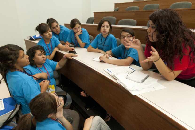 Viridiana Medellin (right) leads a group of high school students in a self-esteem workshop...