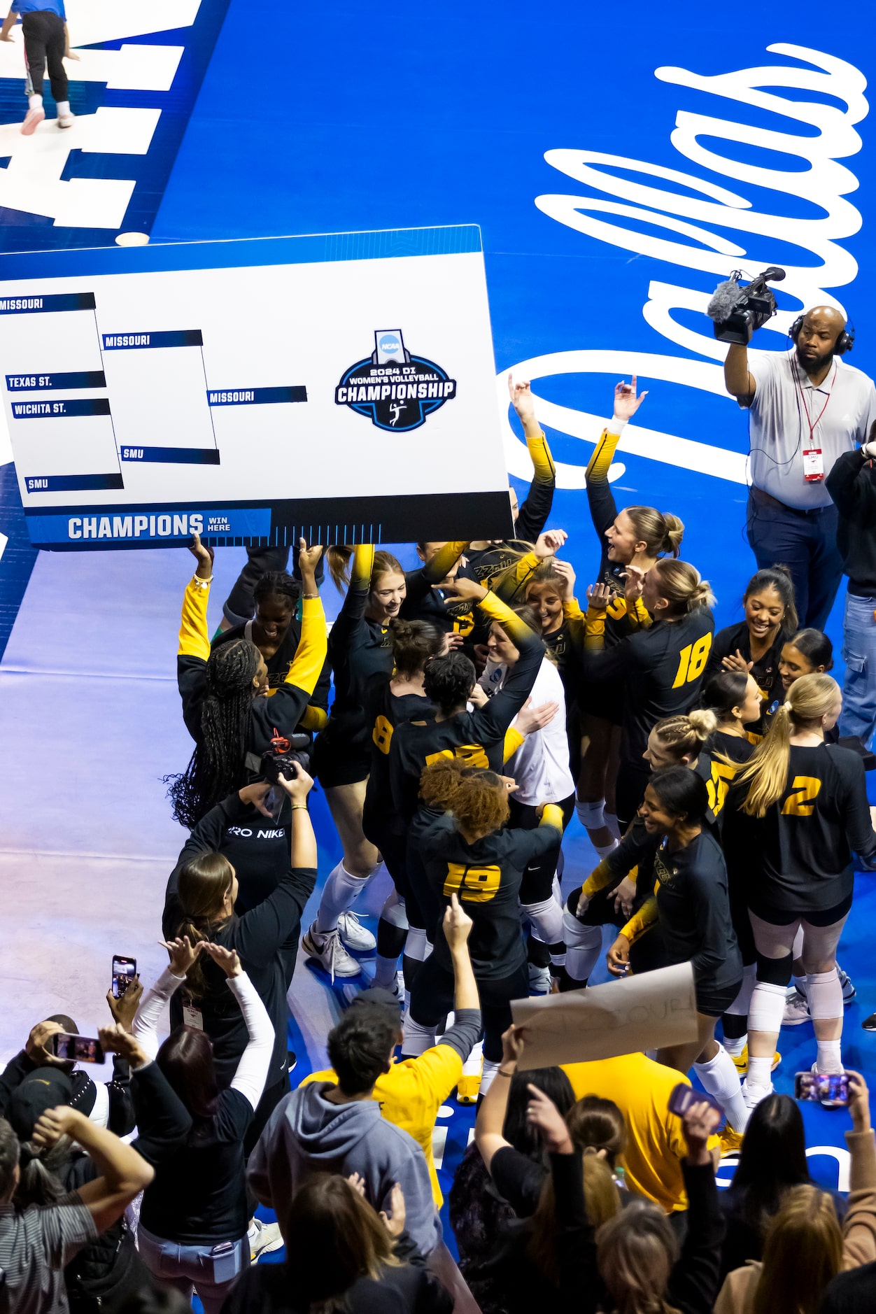 Missouri celebrates beating SMU in four sets in an NCAA college volleyball game at SMU in...