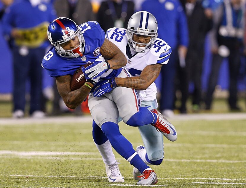 Dallas Cowboys cornerback Orlando Scandrick (32) makes a open field tackle of New York...