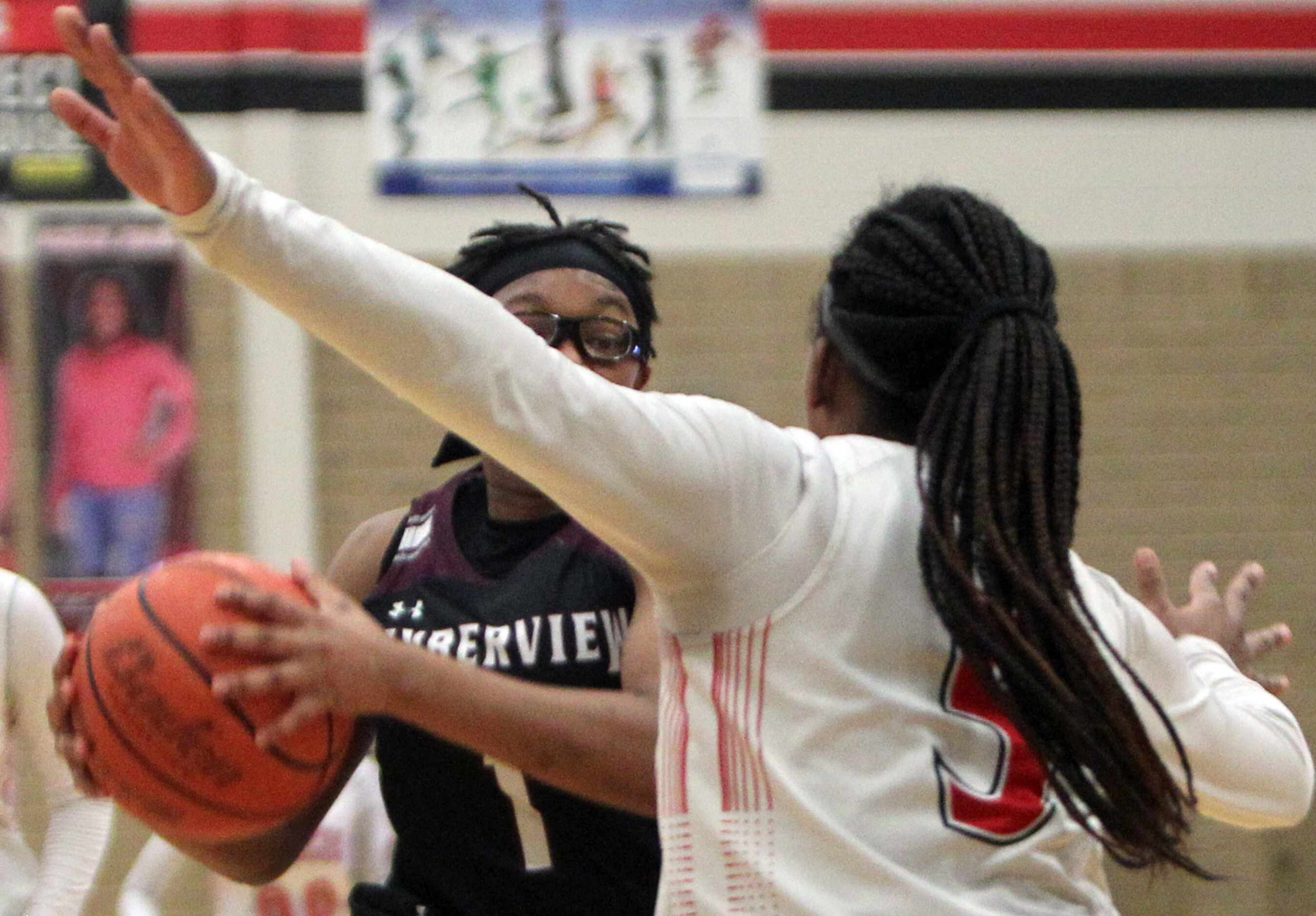 Mansfield Timberview guard Tamaiya Mims (1), eyes the defense of Mansfield Legacy guard...