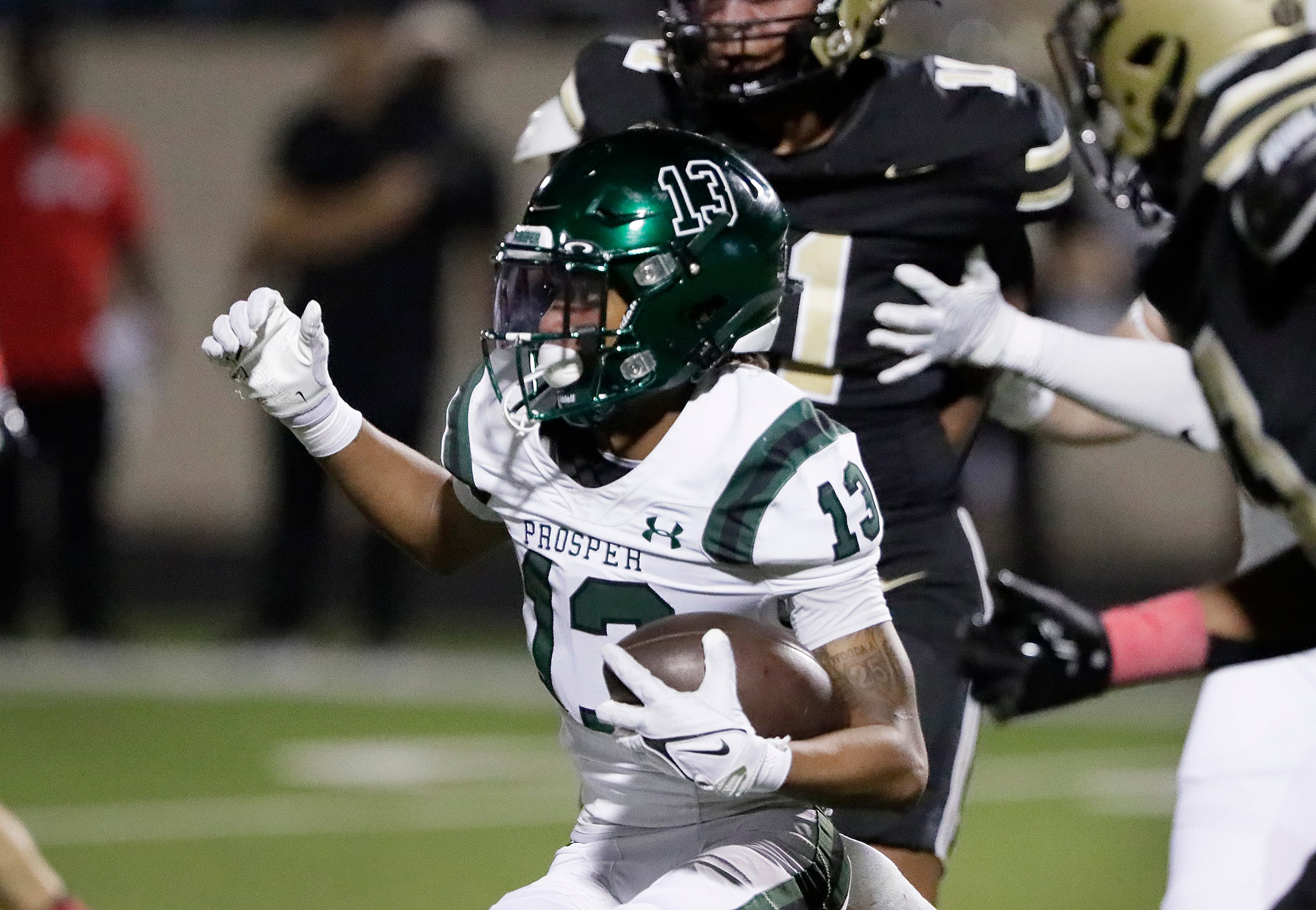 Prosper High School’s Marcus Carr run with the football during the first half as Plano East...