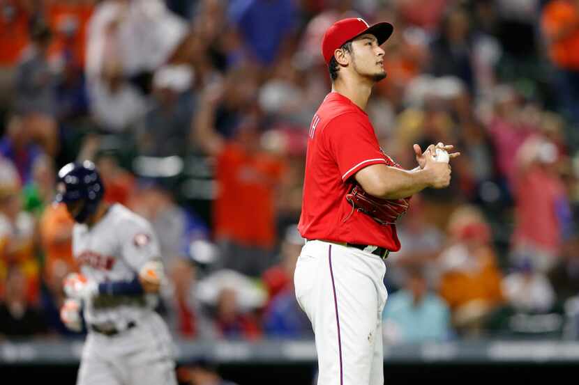Texas Rangers starting pitcher Yu Darvish (11) looks towards the video board as Houston...