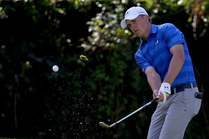 Jordan Spieth hits a chip shot during the first round of the Northern Trust Open at Riviera...