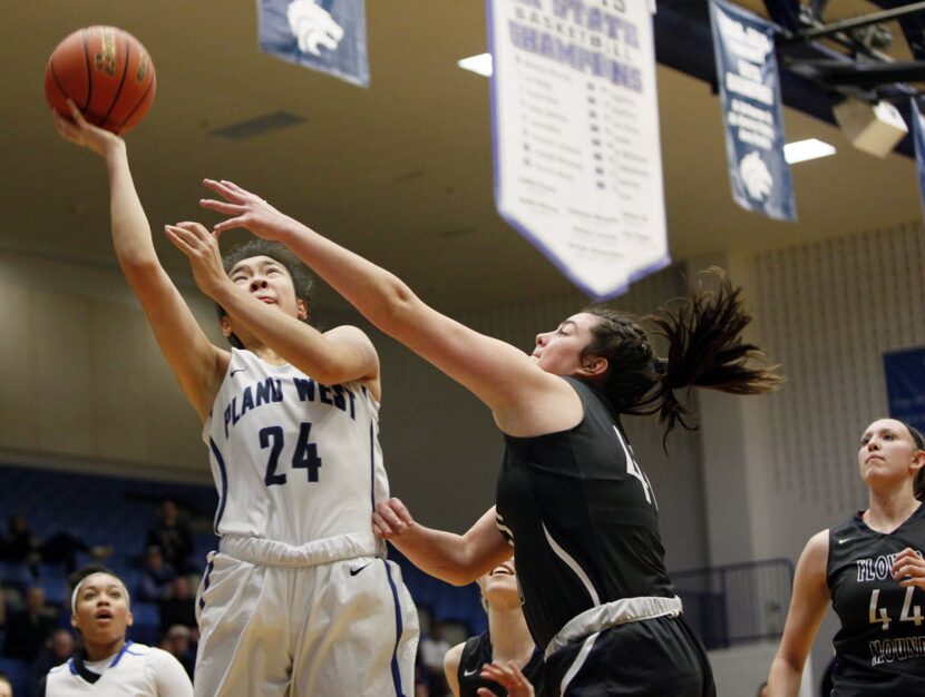 Plano West senior forward Natalie Chou (24) leaps for a layup while defended by Flower Mound...