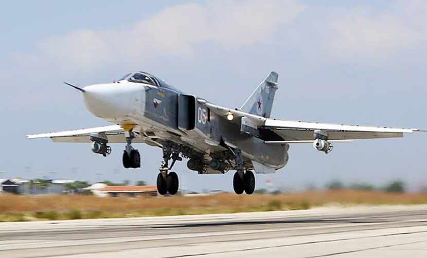 A Russian Sukhoi Su-24 bomber takes off on Oct. 3 from the Hmeimim airbase in the Syrian...