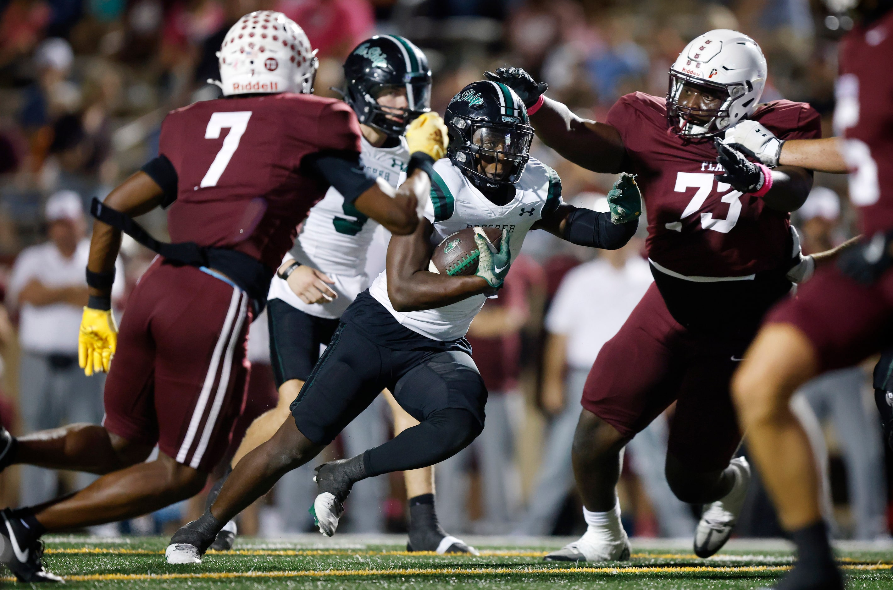 Prosper High running back Bryce Robinson (6) carries the ball for a touchdown as Plano...