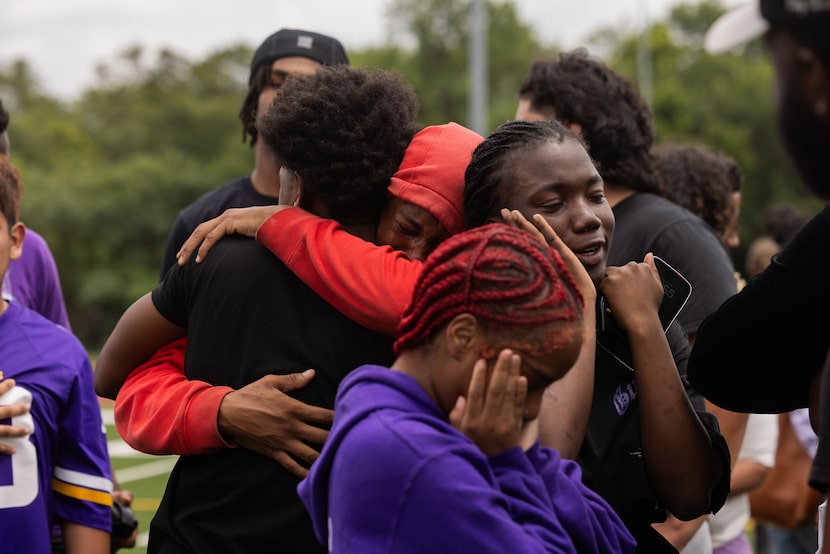 Family and friends grieve at Conrad High School after a balloon release commemorating the...