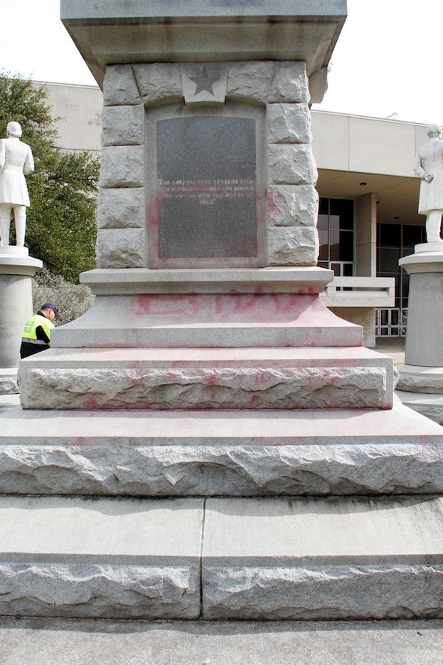 The faint markings of graffiti left after workers from Bronze Conservation cleaned the...