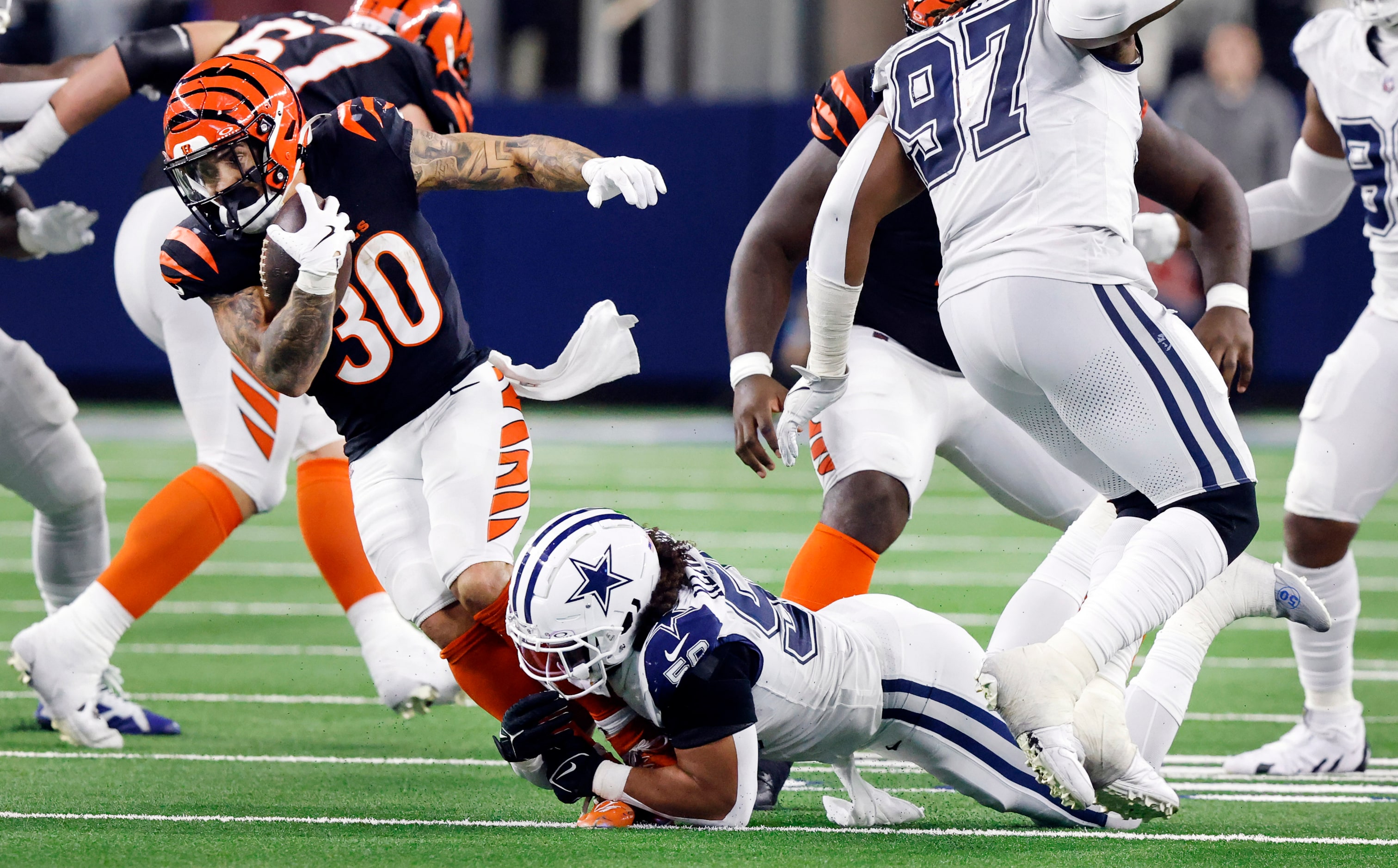 Dallas Cowboys linebacker Eric Kendricks (50) drops Cincinnati Bengals running back Chase...