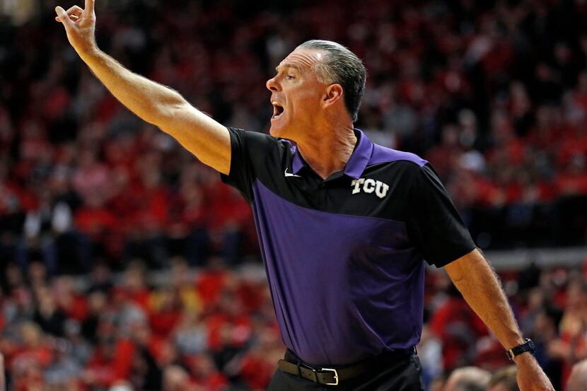 TCU coach Jamie Dixon yells out to his players during the first half of an NCAA college...