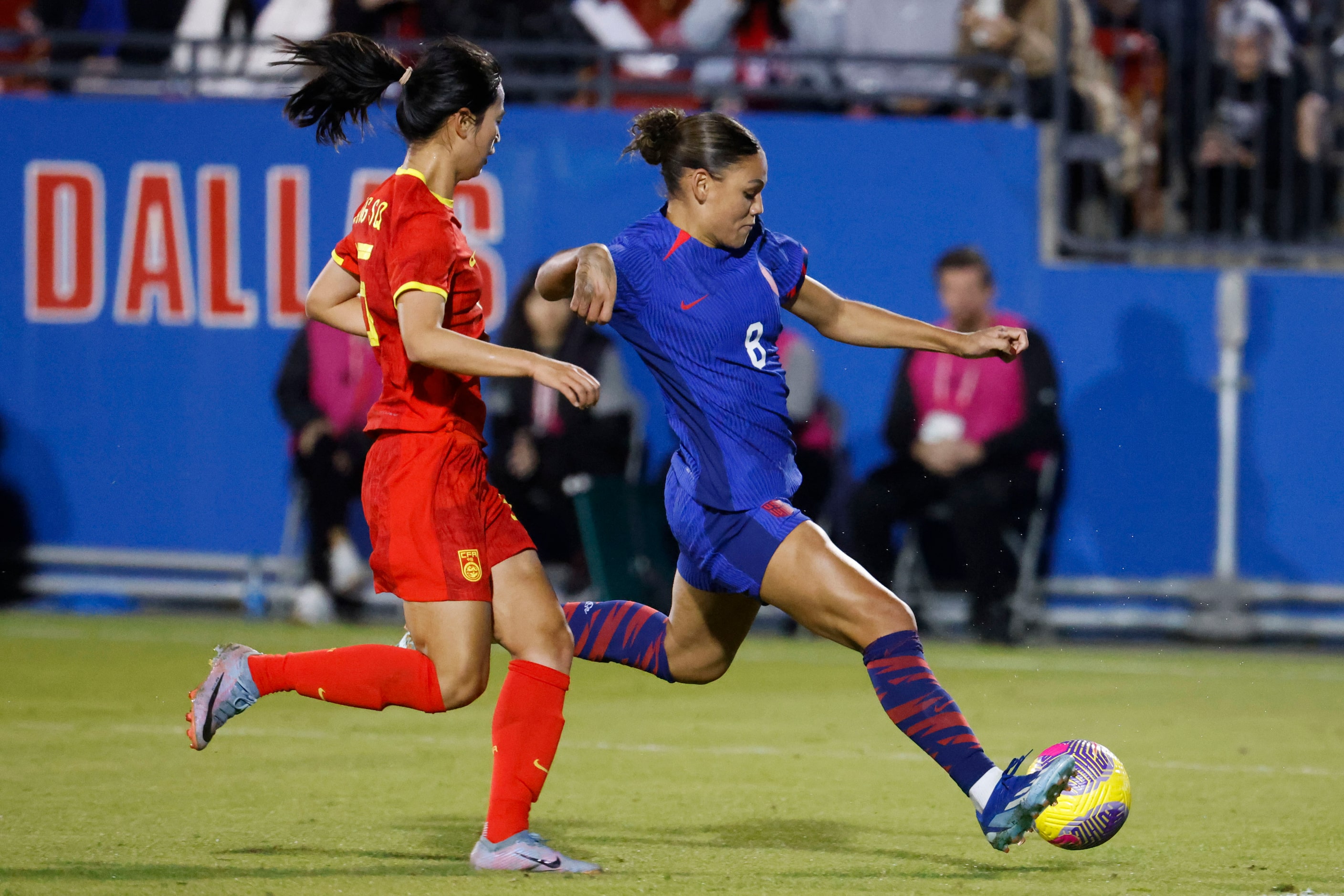 China’s Wang Siqian (left) runs as United States’ Trinity Rodman shoots during the second...