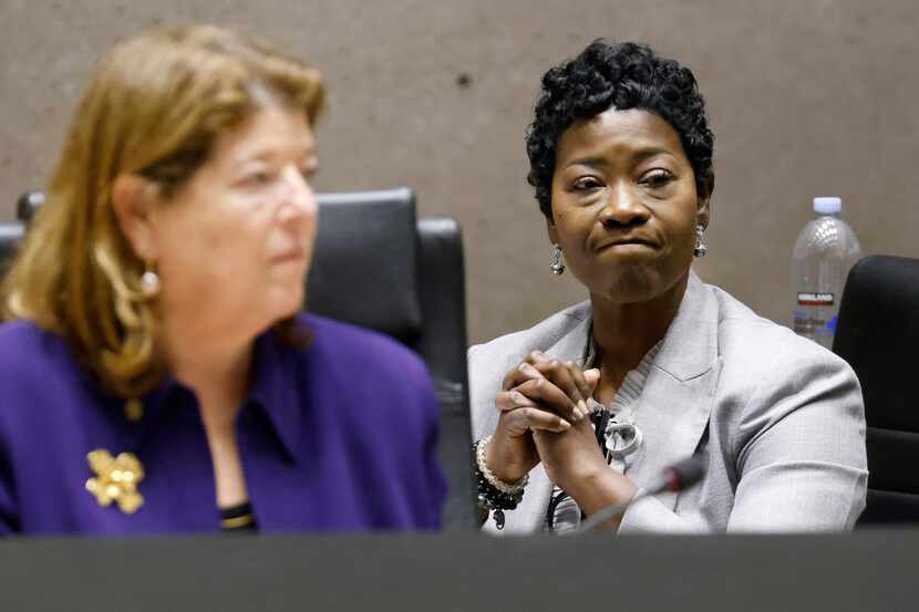 Kimberly Bizor Tolbert  (right) reacts to the supportive 12-2 roll call vote by Dallas City...