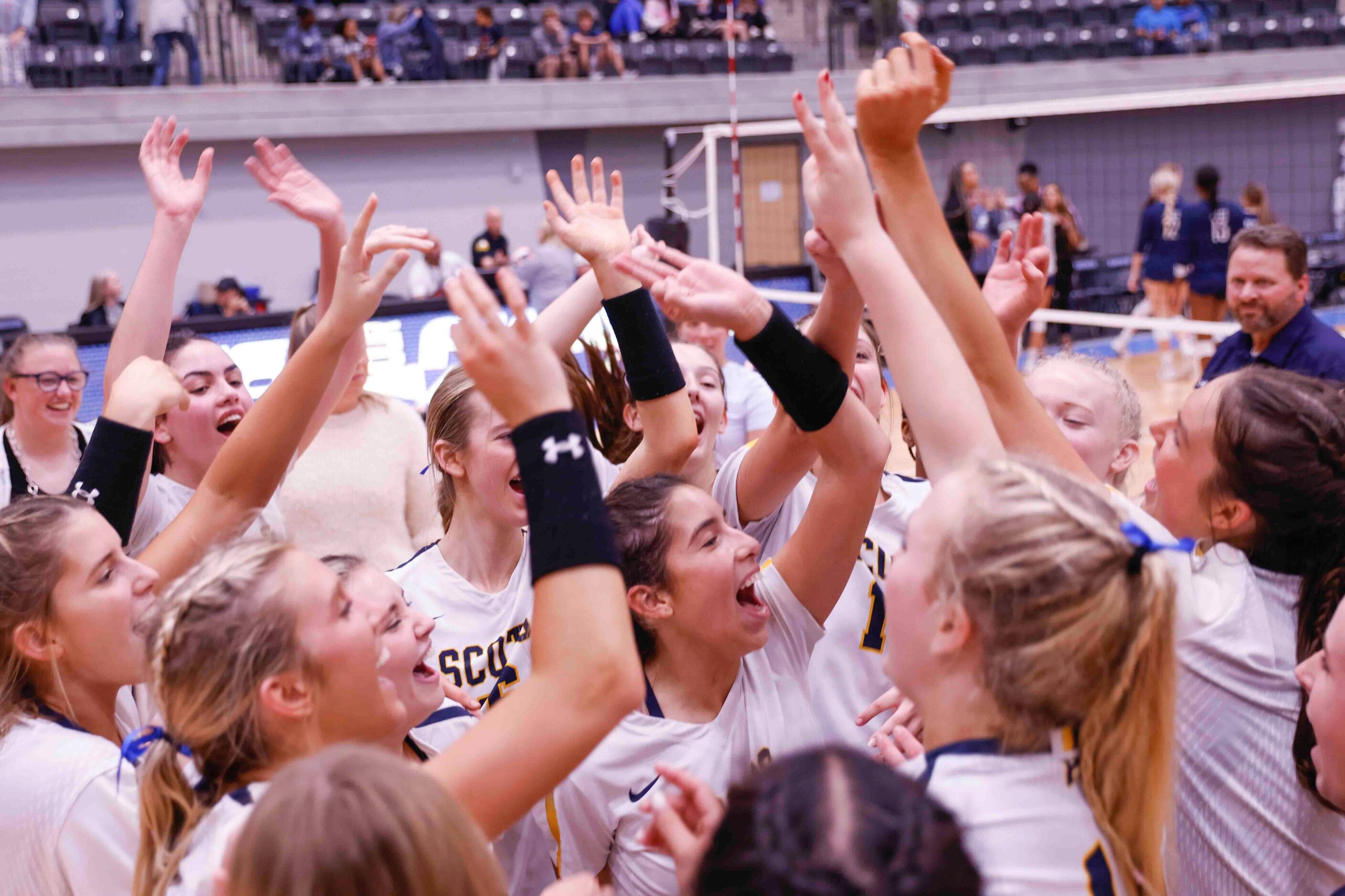 Highland Park players celebrate after winning against Flower Mound during a volleyball game...