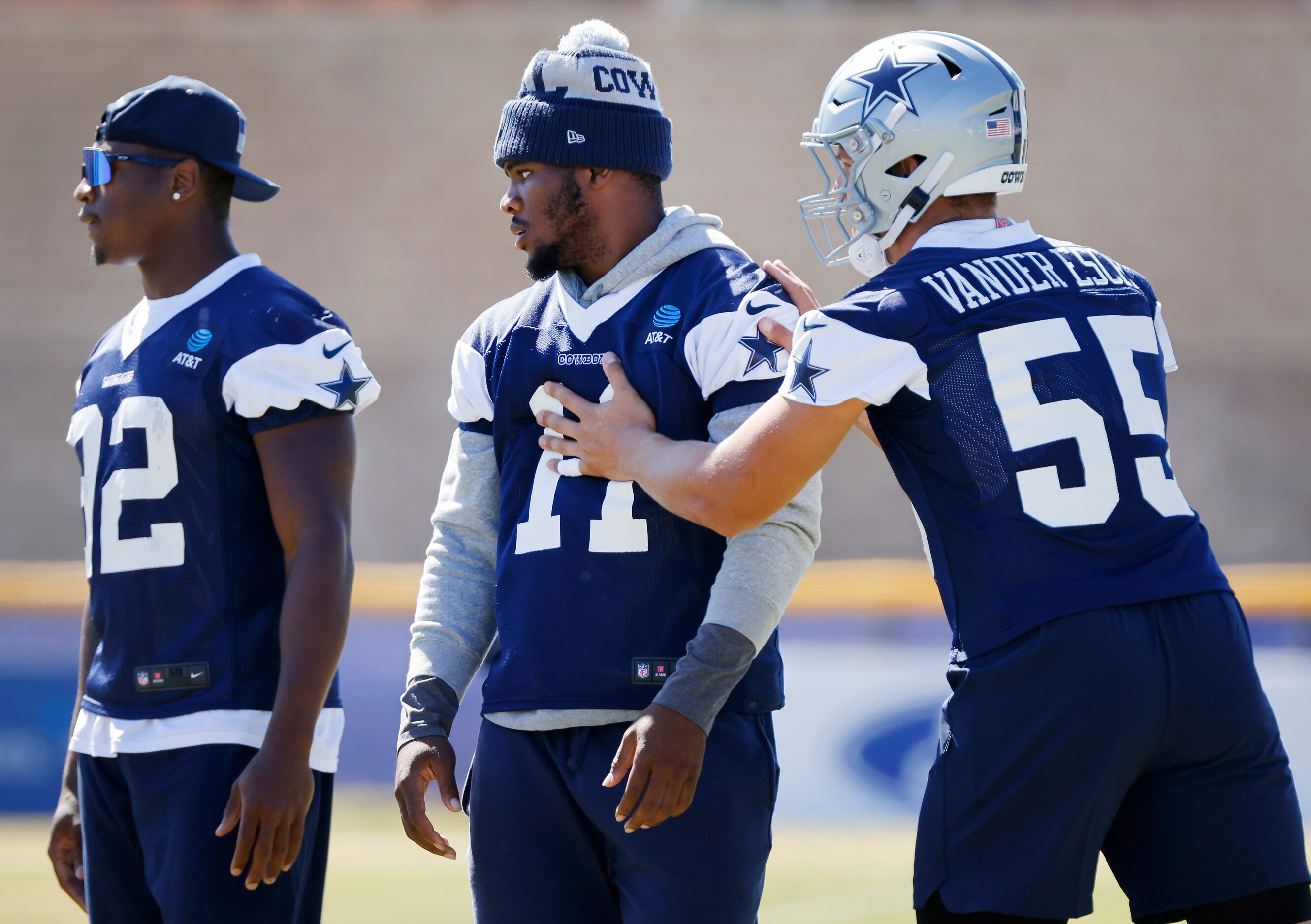 Dallas Cowboys outside linebacker Leighton Vander Esch (55) directs Micah Parsons (11) as...