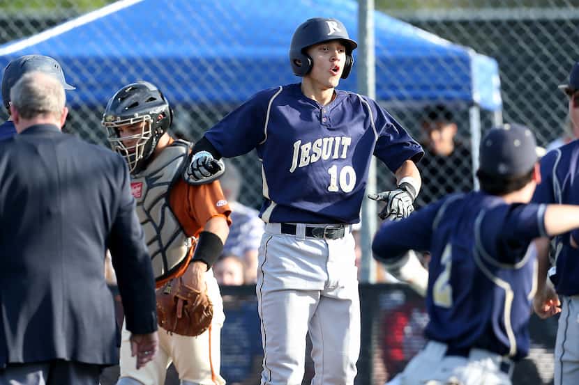 Jesuit Rangers center fielder Darius Hill (10) reacts to scoring a home run against the W.T....