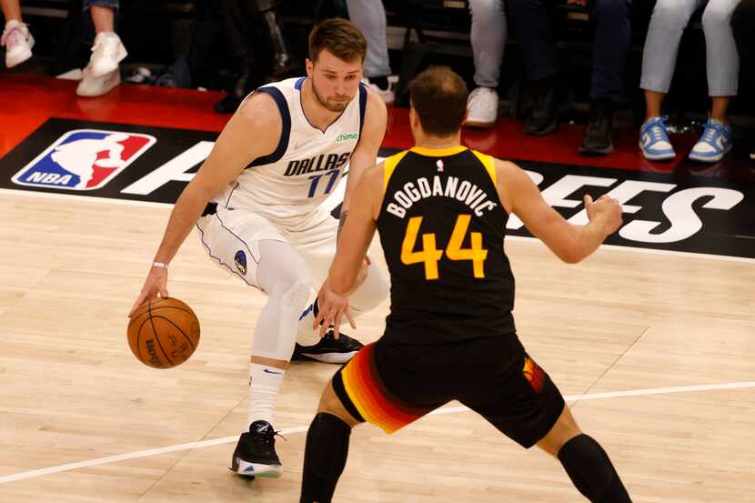 Dallas Mavericks guard Luka Doncic (77) attempts to get by Utah Jazz forward Bojan...