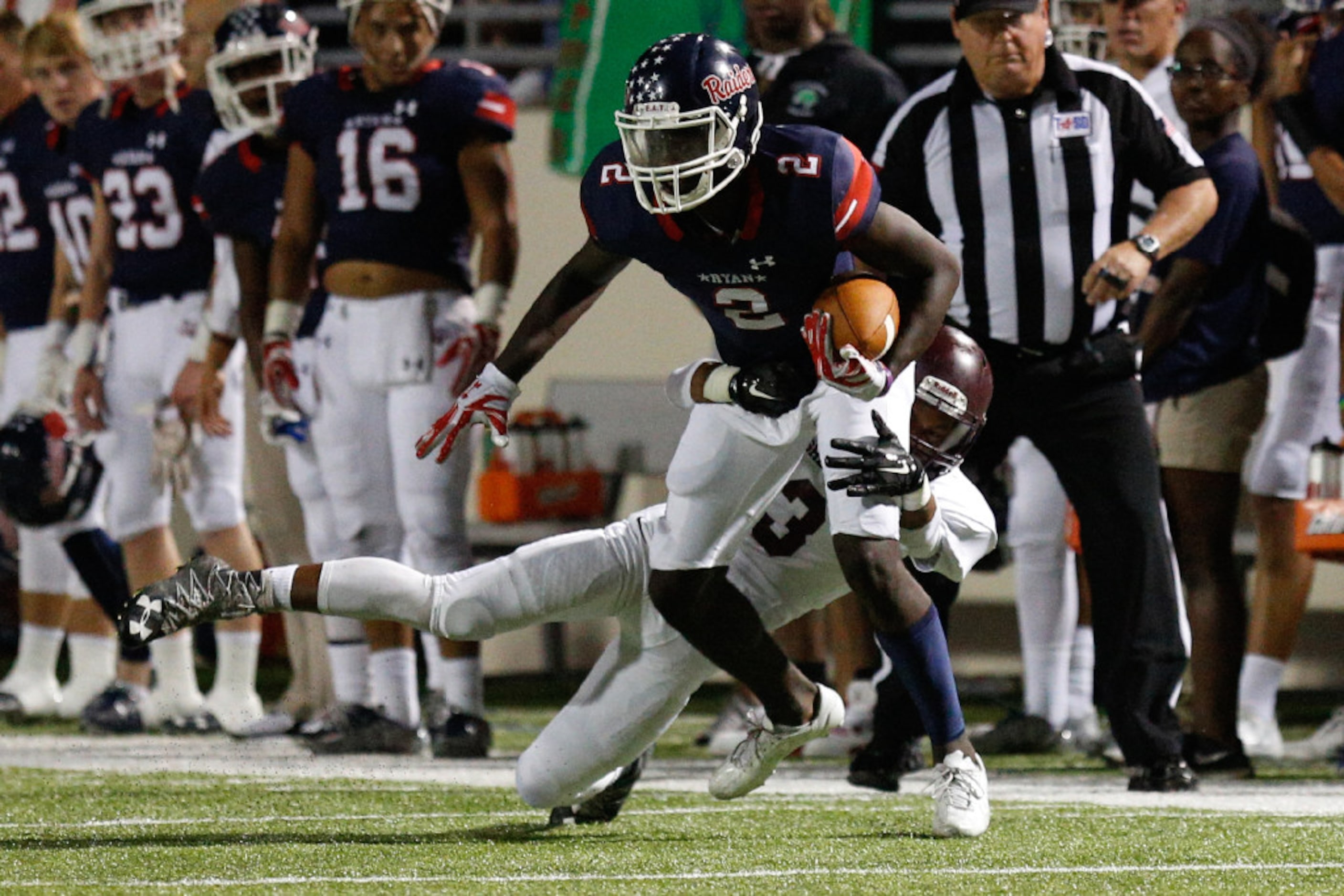 Ryan junior wide receiver Gabriel Douglas (2) runs after he makes the catch, while Sherman...