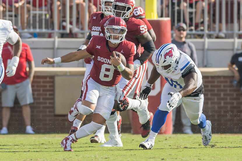 Oklahoma quarterback Dillon Gabriel (8) carries for a first down during the first half of...