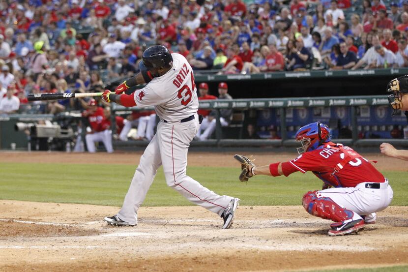 May 10, 2014; Arlington, TX, USA; Boston Red Sox designated hitter David Ortiz (34) hits a...
