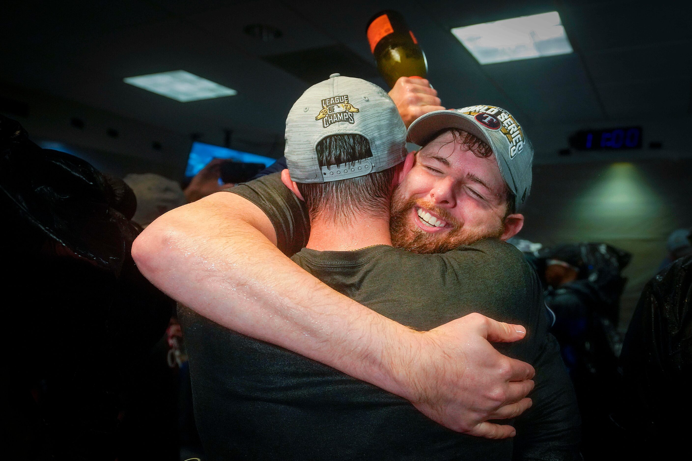 Texas Rangers starting pitcher Jordan Montgomery celebrates in the clubhouse after the...