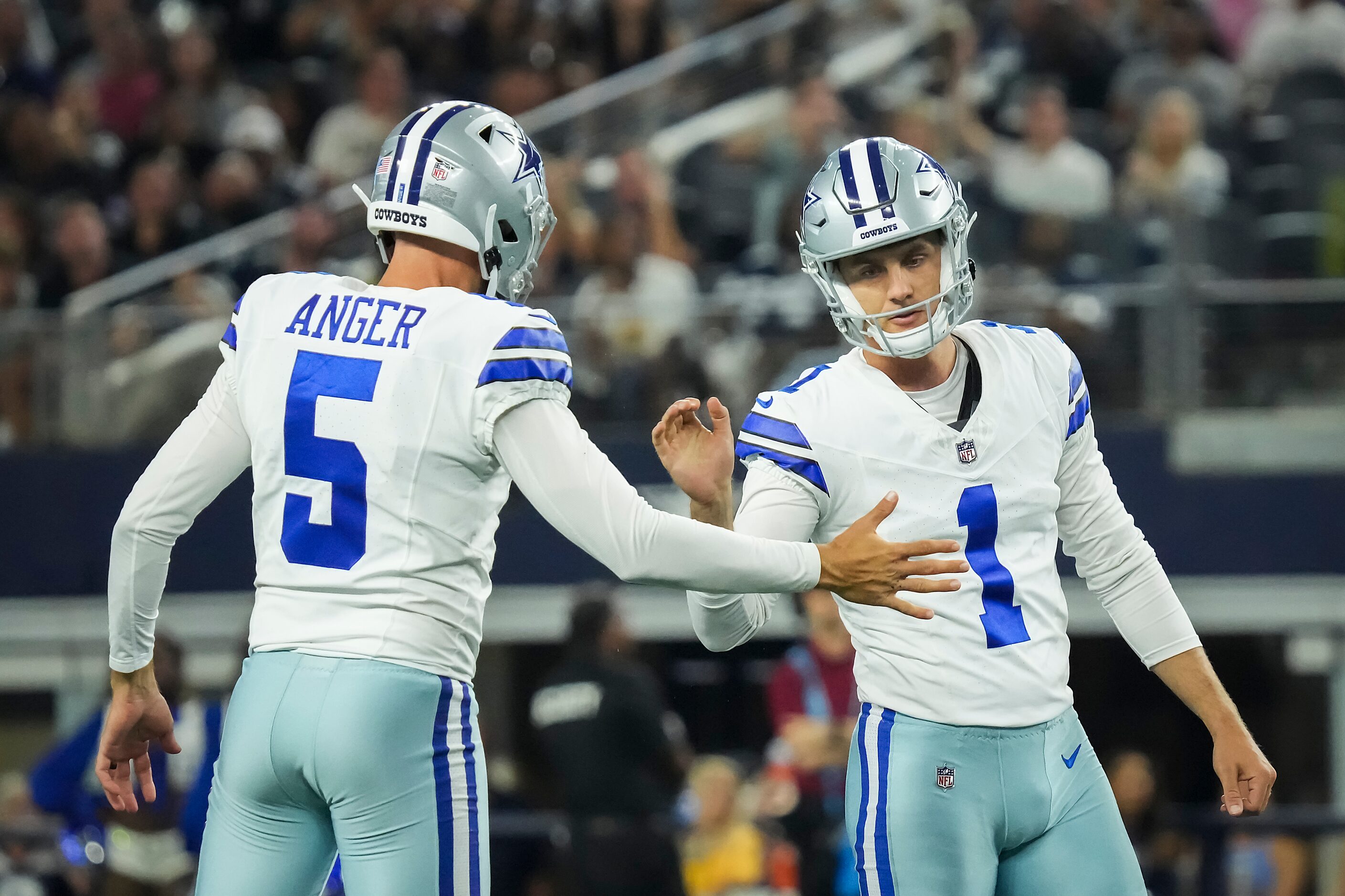 Dallas Cowboys kicker Brandon Aubrey (1) celebrates with punter Bryan Anger (5) after...