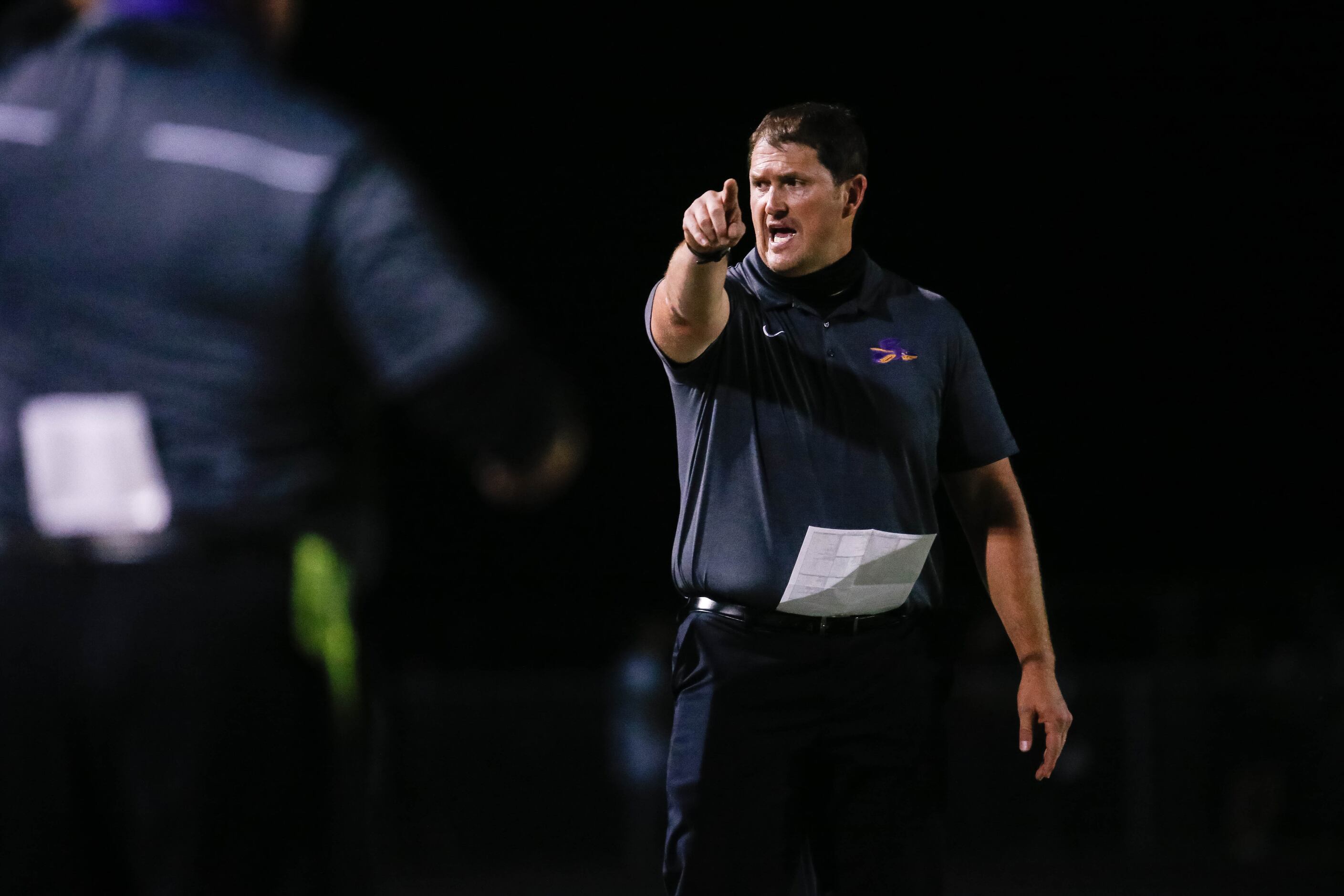 Sanger High School football head coach Rocky Smart points during a game against Lake Worth...