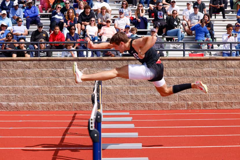 Coppell’s Aidan McFarlane clears the final hurdle as he wins the 6A boys 110 meter hurdles...