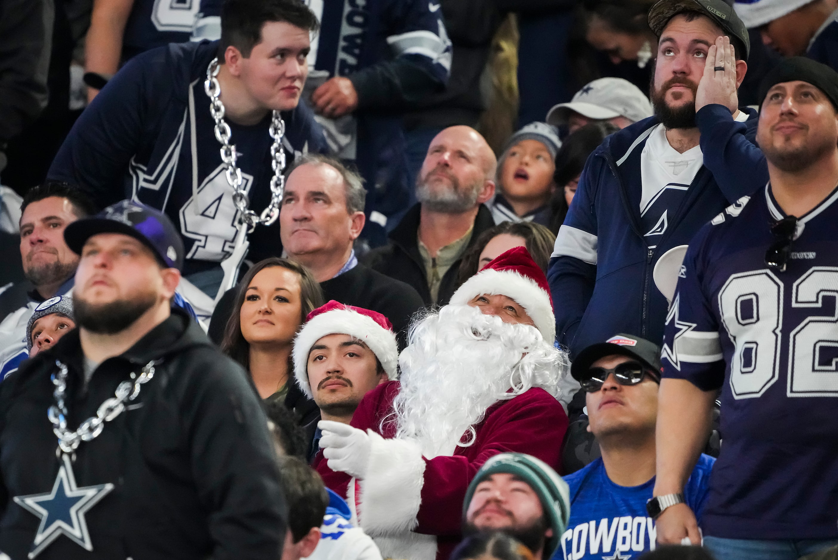 Dallas Cowboys fans react after a Philadelphia Eagles first down during the second quarter...