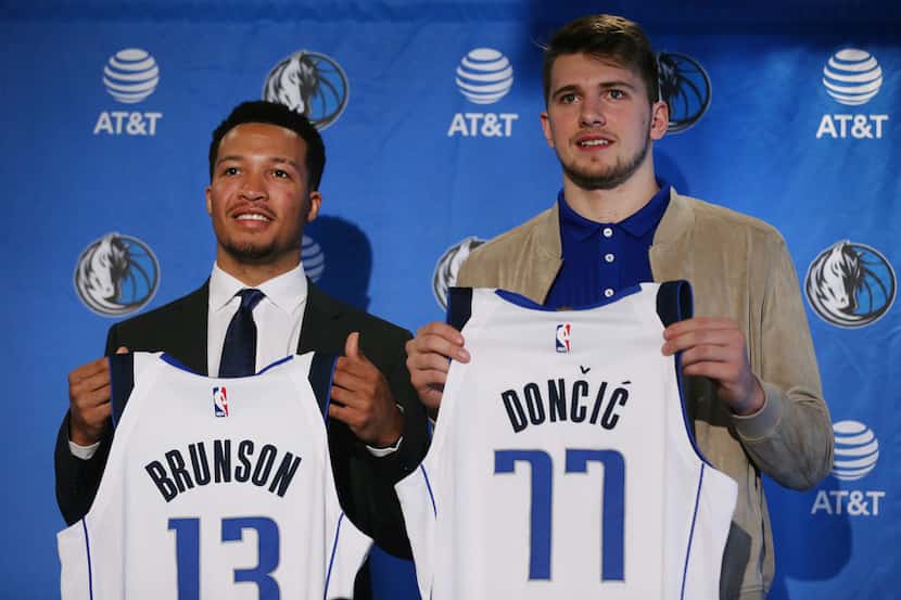 New Dallas Mavericks players Jalen Brunson (left) and Luka Doncic are introduced at the...