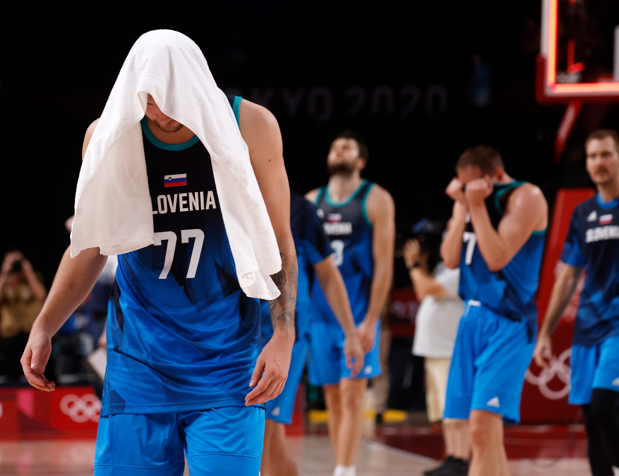 Slovenia’s Luka Doncic (77) walks off the court dejected after losing to France 90-89 after...