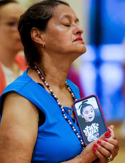 Ana Maria Clift of Allen holds her phone as it displays a photo of Sofia Mendoza, one of the...