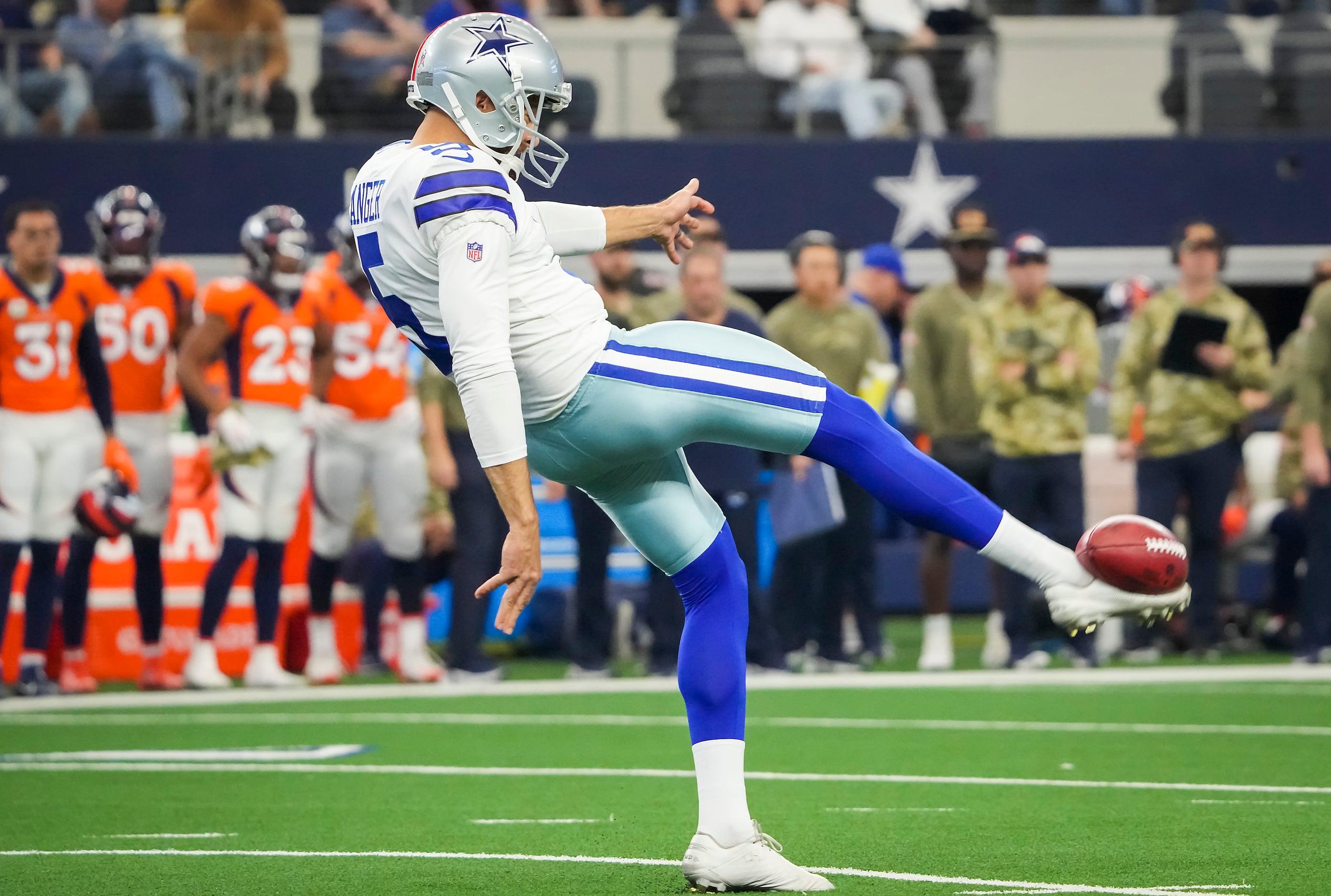 Dallas Cowboys punter Bryan Anger kicks a punt in the second half of an NFL  football game against the Washington Commanders, Sunday, Jan. 8, 2023, in  Landover, Md. (AP Photo/Patrick Semansky Stock