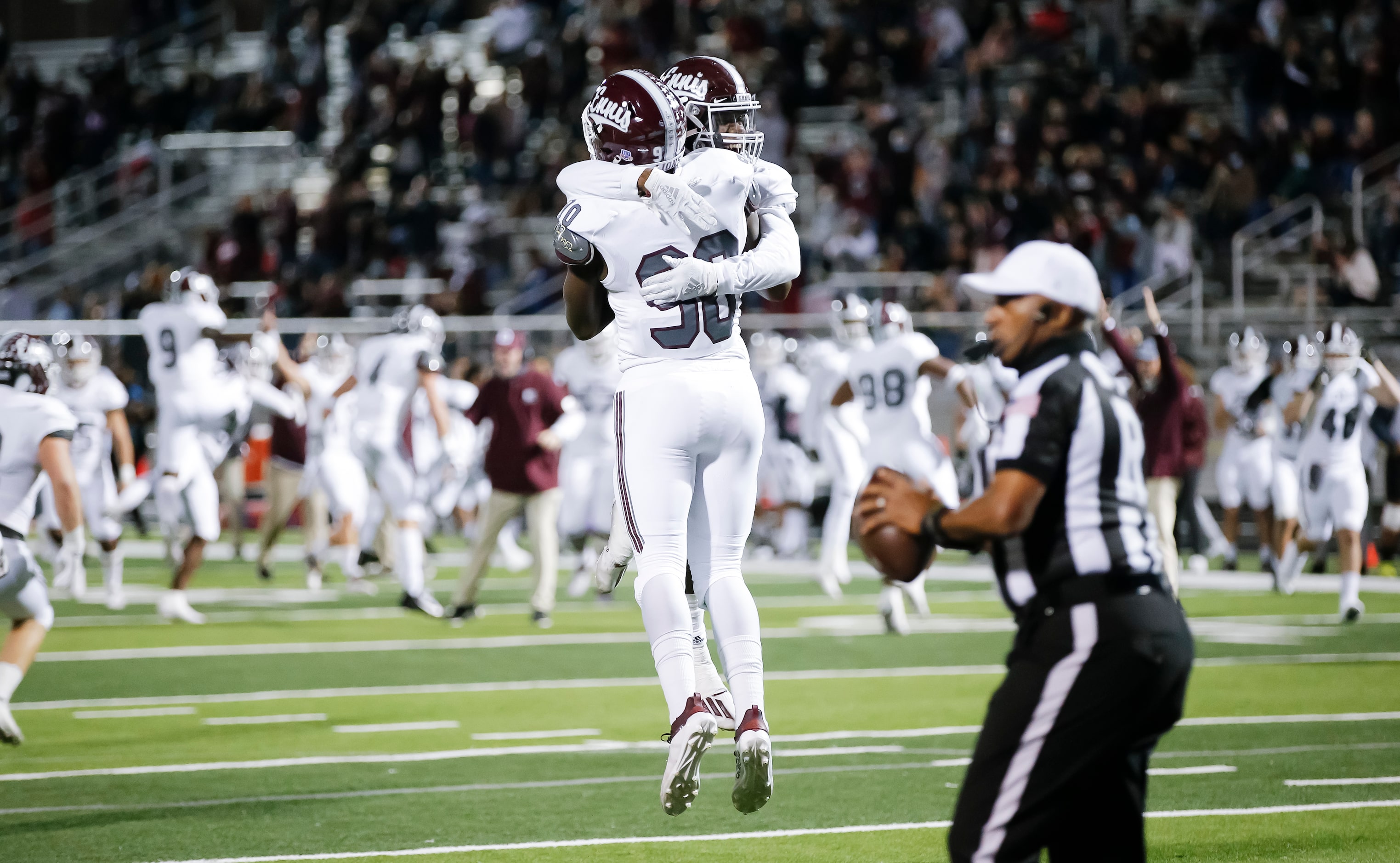 Ennis senior defensive lineman Jarveon Williams (90) is congratulated by senior defensive...