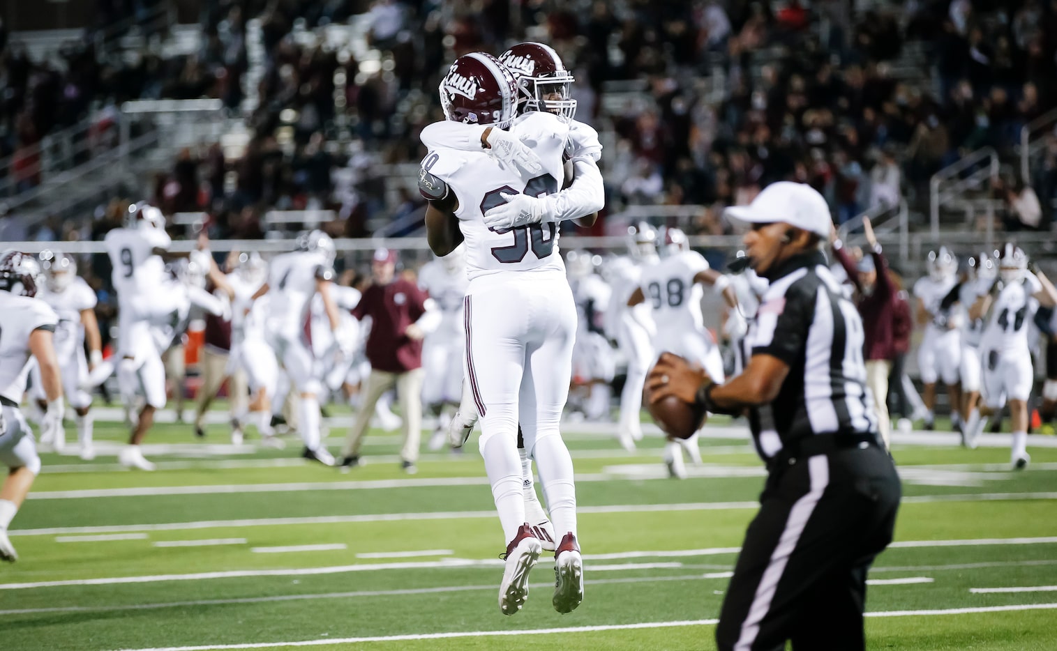 Ennis senior defensive lineman Jarveon Williams (90) is congratulated by senior defensive...