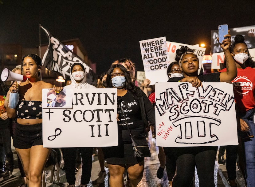 Activist Renee White (left); Marvin Scott III's mother, LaSandra Scott (center); and his...