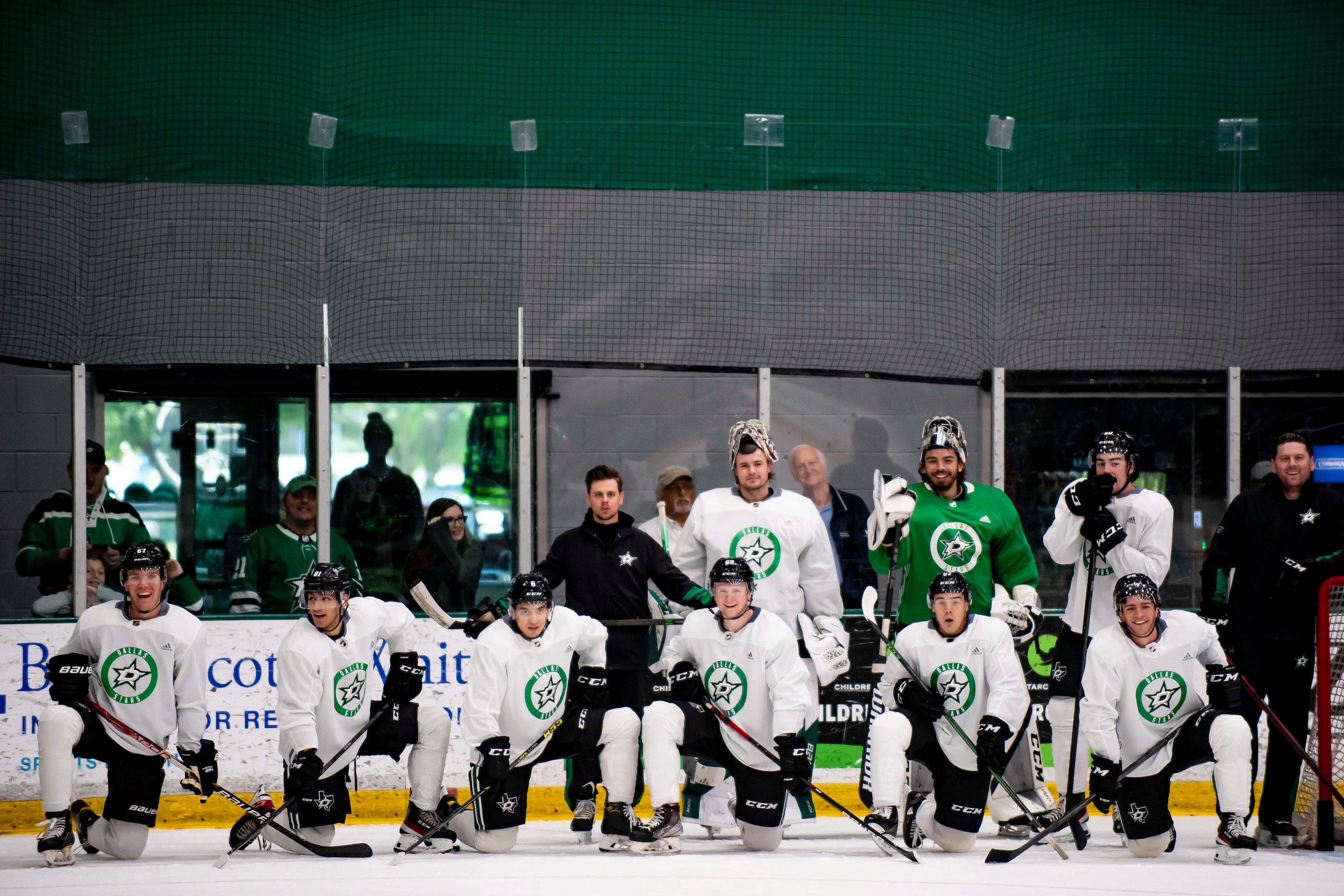 Dallas Stars prospects cheer a teammate on as they score during a drill at the 2022 Dallas...