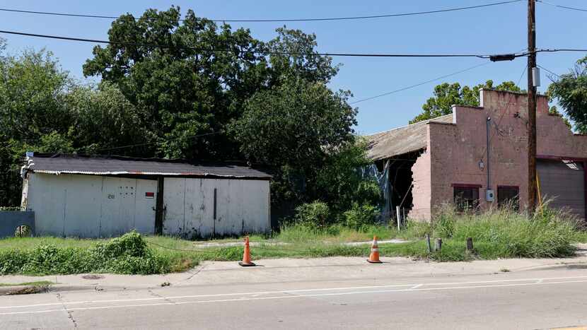 A pair of vacant buildings line Lagow Street in the Mill City neighborhood in South Dallas.