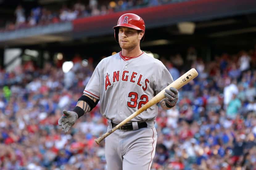 Los Angeles Angels designated hitter Josh Hamilton walks back to the dugout after striking...