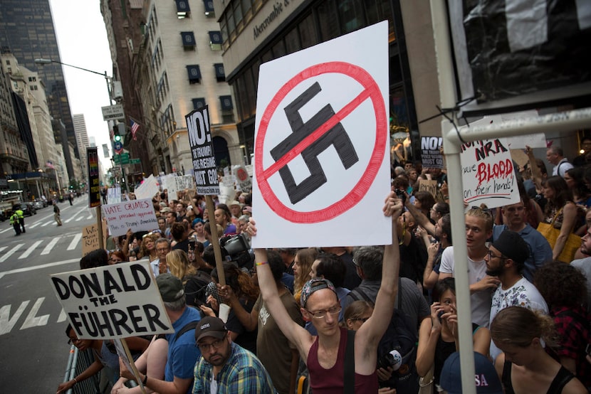 Demonstrators gather in front of Trump Tower ahead of President Donald Trump's arrival in...