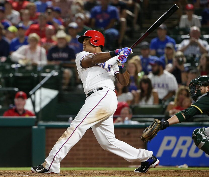 Texas Rangers third baseman Adrian Beltre (29) hits a grand slam in the fifth inning to make...