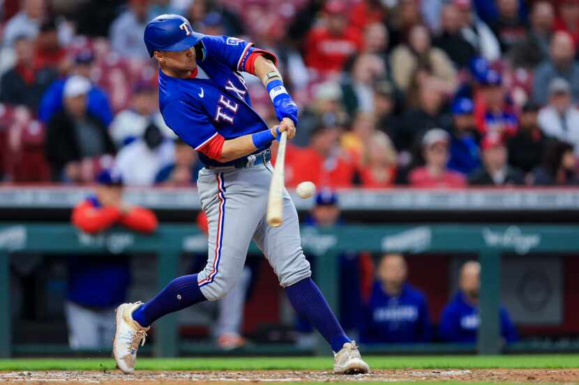 Texas Rangers' Josh Jung hits a two-run double during the fifth inning of the team's...