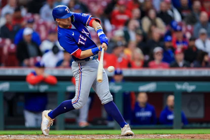 Texas Rangers' Josh Jung hits a two-run double during the fifth inning of the team's...
