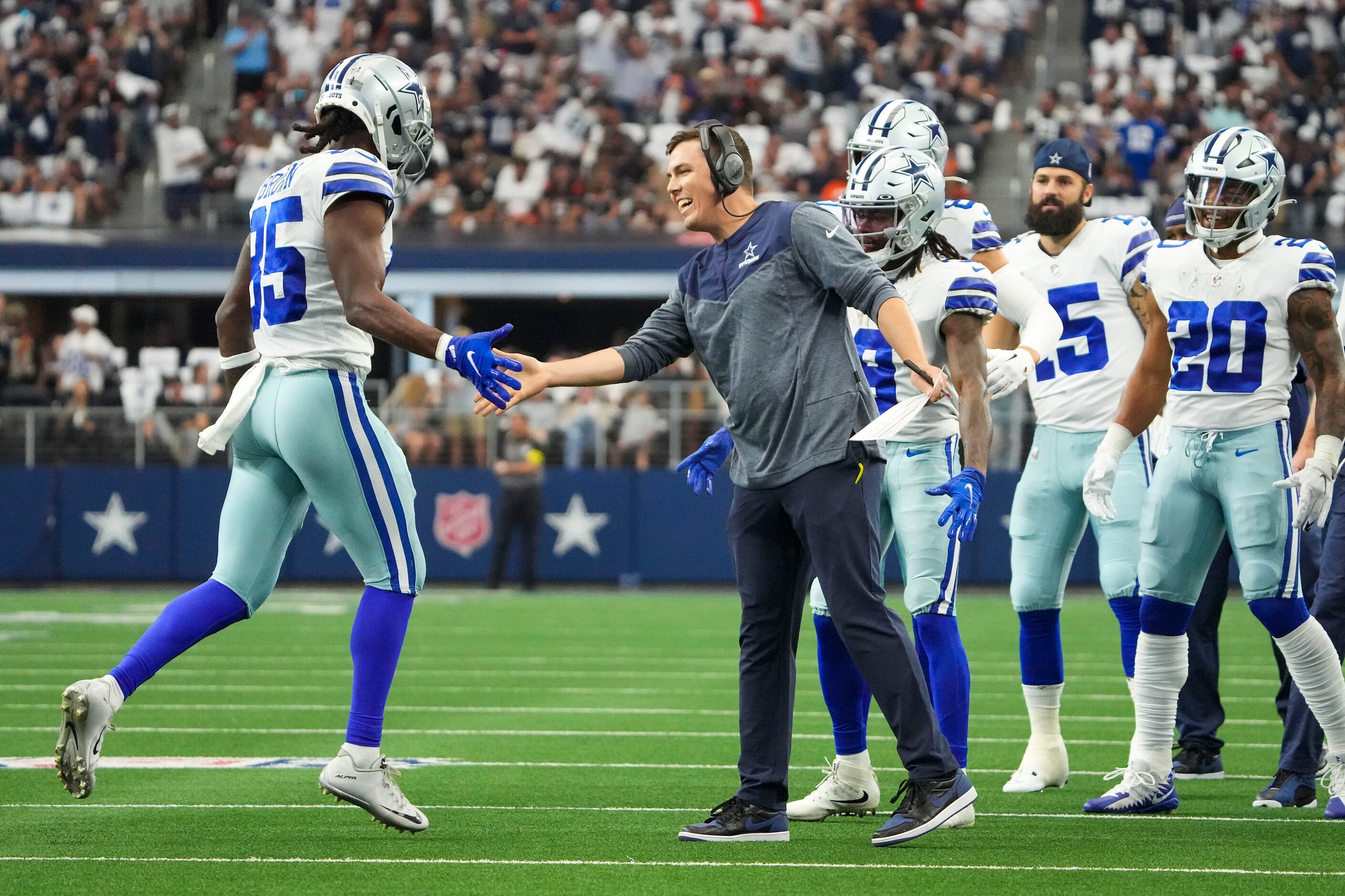 Dallas Cowboys wide receiver Noah Brown (85) gets a hand from offensive coordinator Kellen...