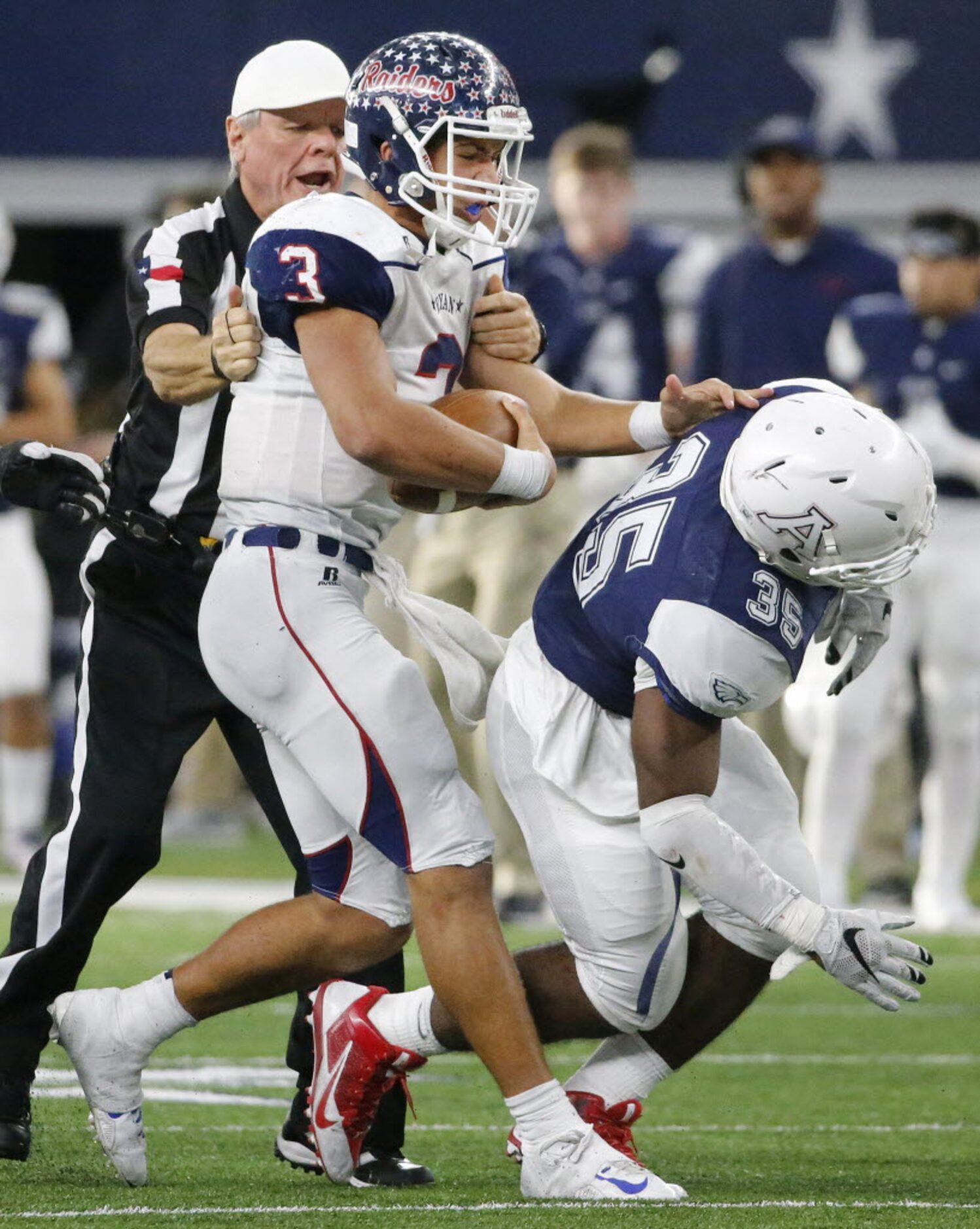 Denton Ryan quarterback  Spencer Sanders (3) is restrained by an official after taking...