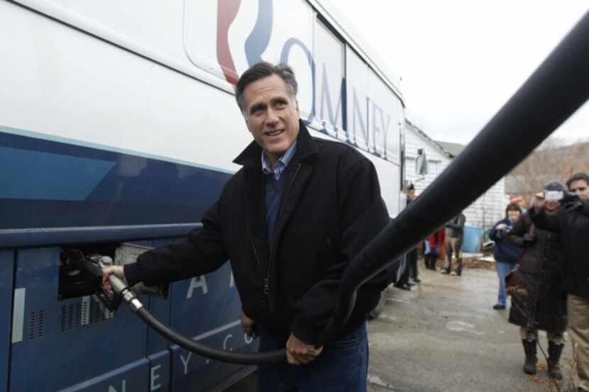 Republican presidential candidate, Mitt Romney pumped diesel into his bus during a campaign...