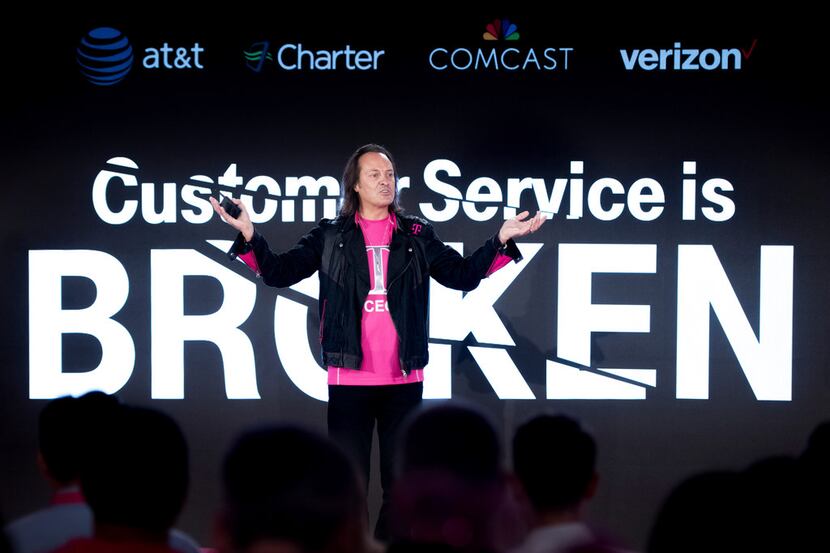 T-Mobile Chief Executive Officer John Legere addresses the audience at T-Mobile's Un-carrier...
