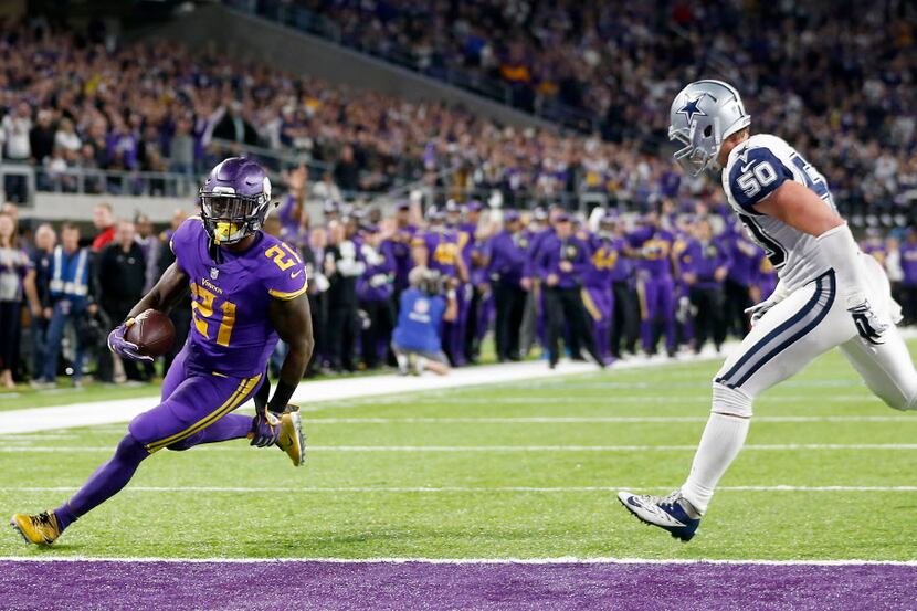Minnesota Vikings running back Jerick McKinnon (21) scores a touchdown past Dallas Cowboys...